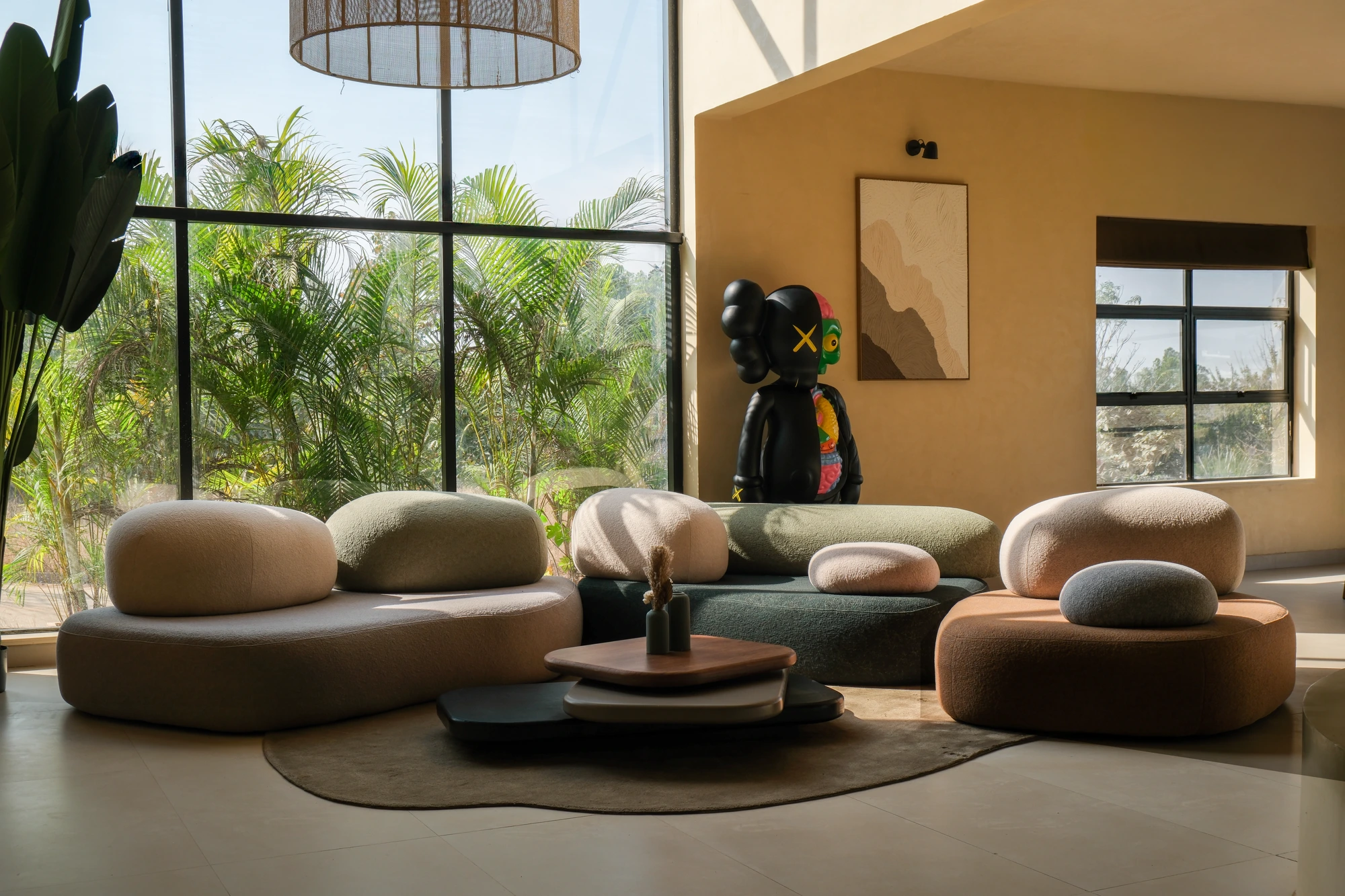 The lounge inside a Dune Villa, wrapped in palms and natural light
